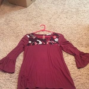 89th + Madison bell 3/4 sleeve maroon shirt.